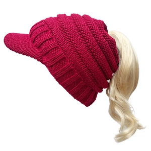 Women's warm red knit ponytail beanie with visor and ribbed texture for winter