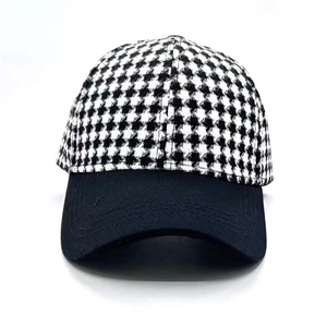 Classic houndstooth baseball cap with black brim for outdoor sun protection and warmth