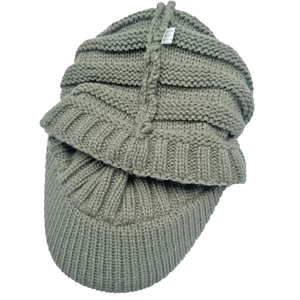 Detail shot of sage green knit beanie showing 100% acrylic material label and texture