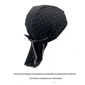 Detail showing breathable black fabric with star print and secure rear tie on headscarf