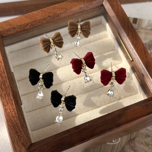 Elegant velvet bow earrings with teardrop pendants in red, black, and brown