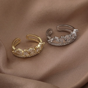 Luxurious double layer crown ring with marquise cubic zirconia on silk background