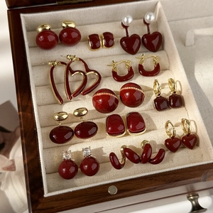 Vintage burgundy enamel heart and geometric stud earrings set in a jewelry box