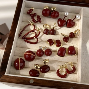 Vintage burgundy enamel and gold heart earring set in a beige velvet jewelry box