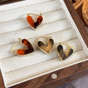 Vintage heart hoop earrings with amber tortoiseshell patterns and gold metal trim