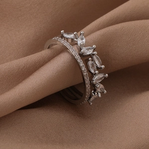 Detailed close-up of double-layer silver ring with marquise-cut zircon leaf patterns