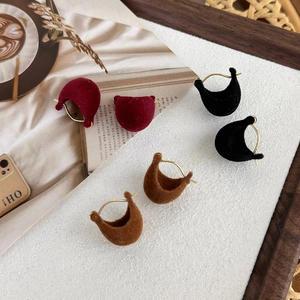 Winter velvet crescent stud earrings in red, black, and brown with gold metal hooks