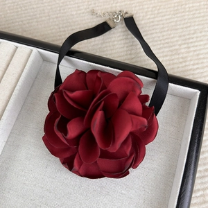 Detail of burgundy satin rose choker necklace with adjustable silver lobster clasp