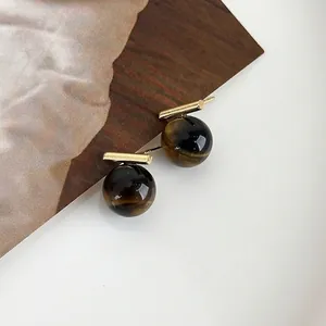 Retro tiger eye stone ball earrings with gold-plated metal bars in minimalist style