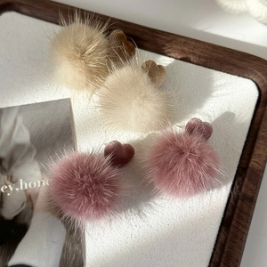 Cute heart-shaped plush ball earrings in warm cream and dusty pink for autumn winter