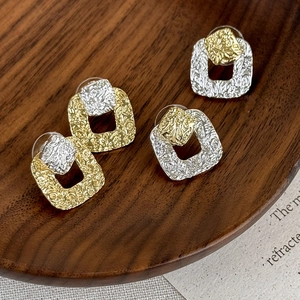 Vintage irregular textured square metal stud earrings in gold and silver contrast