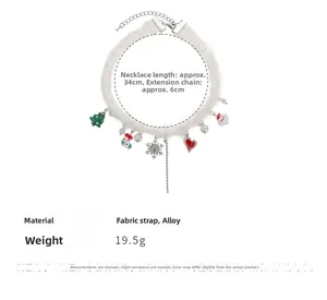 Detailed view of Christmas choker with festive snowflake, pearl, and plush charms