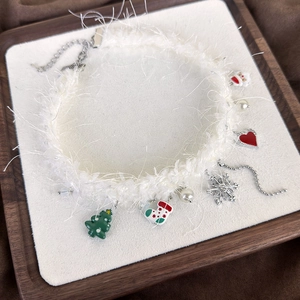 Christmas plush choker with snowflake, pearls, and festive charms on white fur band