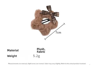 Detail view of 7cm brown plush star hair clip with plaid bow and dimensions info