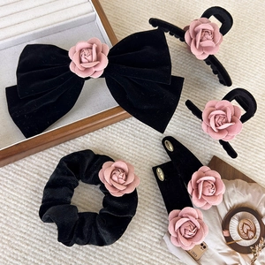 Elegant black velvet hair accessories set featuring dusty pink camellia fabric flowers