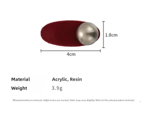 Detail view of a 4cm red velvet oval hair clip with acrylic pearl, weighing 3.9g