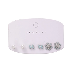 6-piece winter snowflake and bow pearl earring set on a white jewelry display card