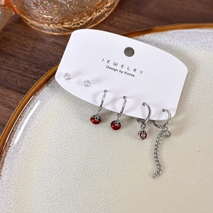 6-piece festive red persimmon earring set with silver studs and good luck charms