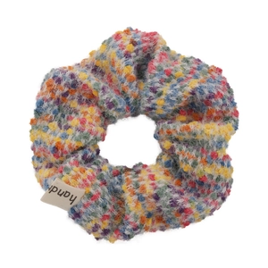 Colorful knitted scrunchie with vibrant yarn and handr brand label for high buns