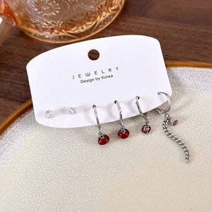 Detailed set of red persimmon earrings with lotus tassels and fortune bag charms