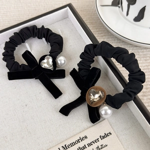Black velvet bow scrunchies with heart rhinestones and pearl pendants for hair styling