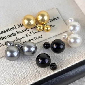 French double-sided pearl earrings in gold, silver, black, and ivory finish