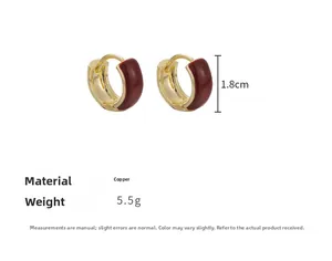 Detail view of 1.8cm red enamel hoop earrings in gold plated copper with 5.5g weight