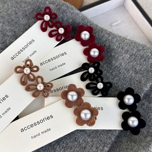 Velvet flower hair clips with faux pearls in wine red, brown and black on display card
