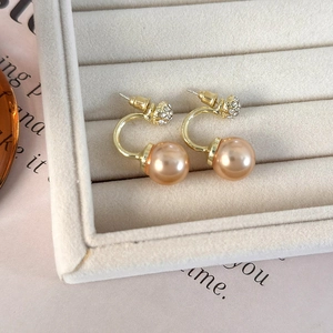 Elegant champagne gold pearl stud earrings with sparkling rhinestones in C-shaped design