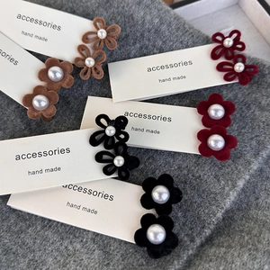 Elegant velvet flower hair clips with faux pearls in brown, burgundy, and black