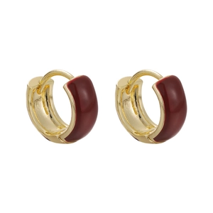 Elegant gold huggie earrings with deep red enamel glaze for a modern festive look