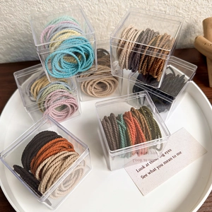 50pcs multi-color high elastic hair bands set in transparent boxes on white tray