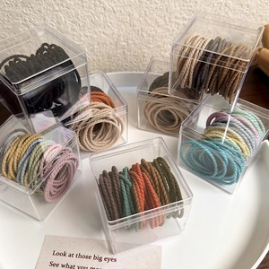 Caramel tone high elasticity hair ties set in a transparent acrylic storage box