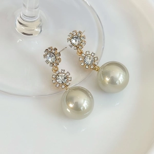 Elegant gold drop earrings with crystal sunflower studs and large faux pearl pendants