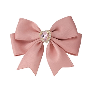 Elegant pink silk bow hair clip with a sparkling heart-shaped rhinestone center