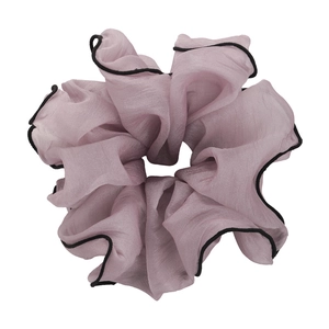 Large pink chiffon scrunchie with black trimmed edges and a wave-like texture