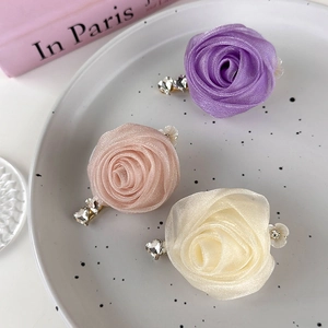 Handmade organza rose hair clips in purple, pink, and cream with sparkling rhinestones