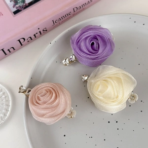 Elegant handmade organza rose hair clips with crystal heart accents in soft colors