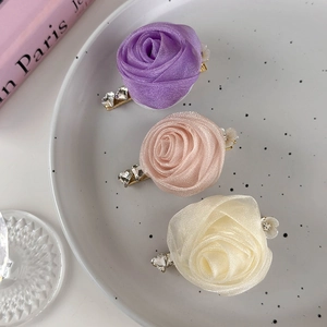 Three handmade gauze rose hair clips in lavender, pink, and white with zircon accents
