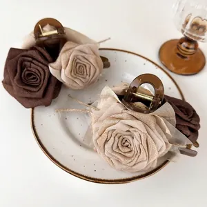 Elegant vintage rose fabric hair claw clips in champagne and brown satin colors