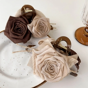 Elegant dried rose flower hair claw clip in dark brown and beige fabric for women