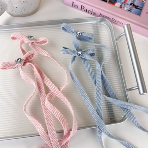 Pink and blue ribbon hair clips with heart rhinestones for ballet style hairstyles