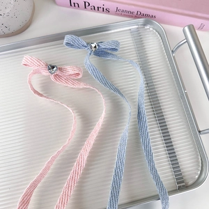Pink and blue ribbon bow hair clips with heart rhinestone accents in balletcore style