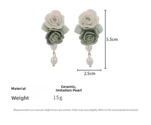 Detail view of vintage ceramic rose earrings with pearls and dimensions 5.5cm by 2.5cm