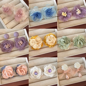 Collection of nine styles of mesh flower earrings with pearls and resin roses for women