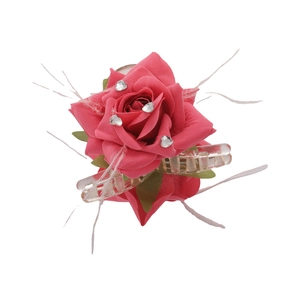 Pink floral hair claw clip with crystal rhinestones and white feather accents on white backdrop