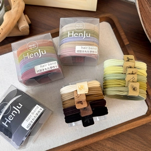 Macro shot of 5-piece plush high-elastic hair ties in neutral colors and Morandi tones