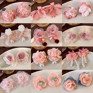 Detailed collection of 12 floral earrings featuring organza, pearls and soft lace textures