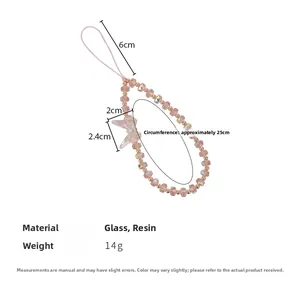 Détail de la lanière de téléphone en cristal rose avec papillon et dimensions