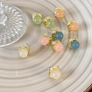 Square gold earrings with translucent colorful beads in peach, blue, and green tones